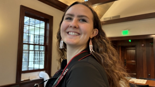 woman with long brown hair and smile